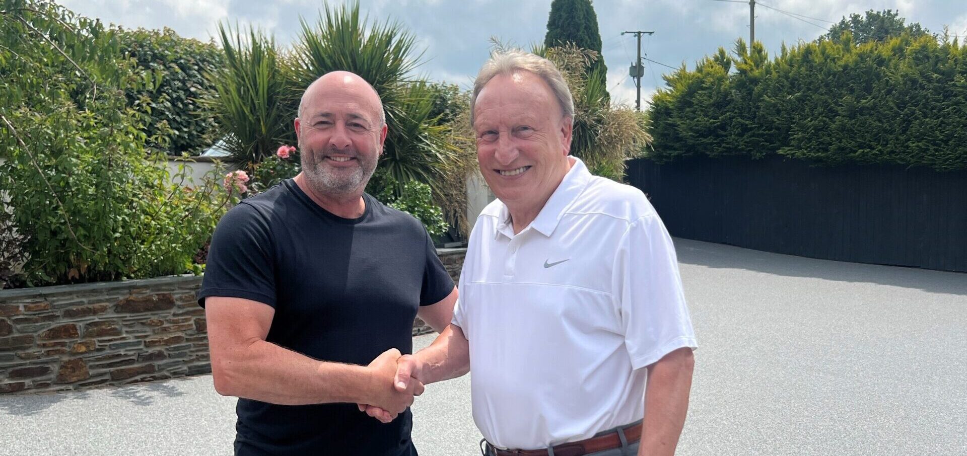 Neil Warnock and Jason shaking hands on Neils new driveway